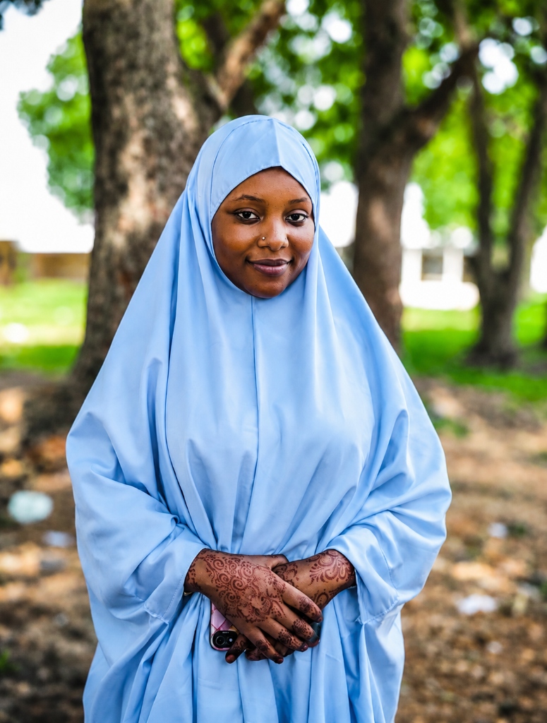 Young Nigerian woman with phone